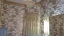 Hung wallcovering and glazed trim and doors with gold metallic glaze